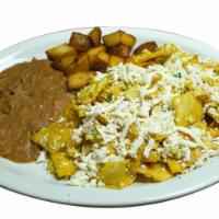 Migas · Tortillas with eggs served with beans, and potatoes.