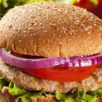 Turkey burger  · Turkey burger, cheddar cheese, romain lettuce r and tomatoes on a seeded bun