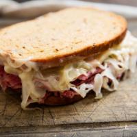 Reuben  · Corn beef, sauerkraut, Russian dressing with Swiss cheese on a toasted rye bread 
