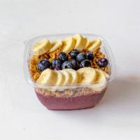 Acai Bowl · Creamy acai, strawberries, banana in a granola and fruit top.