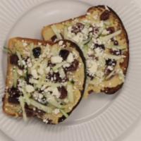 Outer Comstock · Hummus, feta cheese, cucumber, Kalamata olives on sour dough toast.
