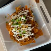 Chili chips · Chips topped with chili, sour cream, cheese, green onions
