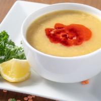 Lentil Soup · Red lentils rooted together with onion and spices.