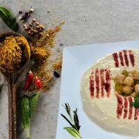 Hummus · Mashed chickpeas, tahini and olive oil.