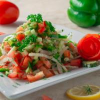 House Salad · Fresh sliced tomatoes, cucumber, onion, olives oil and lemon juice.