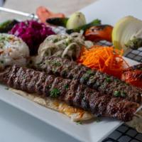 Beef Kabab · Skewers of fresh halal ground beef mixed with onion and parsley, grilled over charcoal and s...