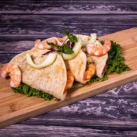 Quesadilla Azteca · Delicious shrimp quesadillas stuffed with huitlacoche, refried beans, and avocado, served wi...