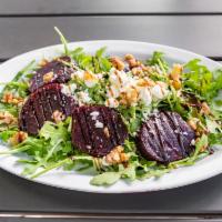 Barbabietole Salad · Arugola, beets, walnuts, goat cheese and balsamic reduction.