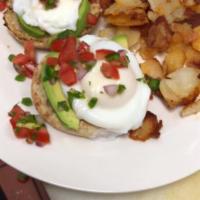 Egg Benedict · 2 poached eggs with Canadian bacon topped with Hollandaise sauce served on an English muffin...