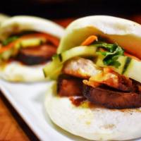 Pork Bao Buns · Tender pork belly, hoisin glaze, pickled cucumber served on a Asian bao bun.