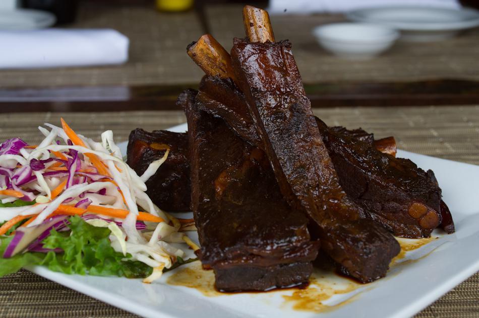 Pork Spare Ribs · Fall-off-the-bore tender barbecued pork ribs with our own special sauce.