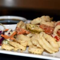Crispy Calamari · Flash fried fresh calamari tossed with cherry peppers and vegetables in a teriyaki sauce.