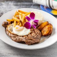 Bistec a Lo Pobre · 10 oz. New York strip steak, fried eggs, french fries, sweet plantains and white rice.