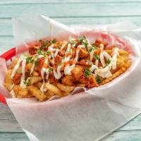 Cheeseburger Loaded Fries · Chopped burger, cheese sauce, sauted onions, pickles, parsley.