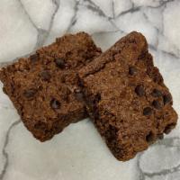 Dark Chocolate Brownie with Quinoa crunch · 100% Organic, Vegan, Gluten Free.
Dark Cocoa, Quinoa 