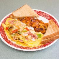 The Western Omelette · Peppers, onions and ham. Served with butter or jelly.