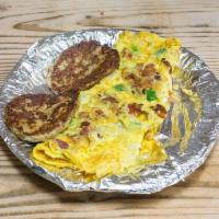 The Bacon Lovers Omelette · Loads of crispy bacon, peppers, onions and cheddar cheese. Served with butter or jelly.