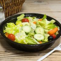 Garden Salad · Mixed greens, carrots, onions, ripe tomato, crisp cucumbers, black olives and a boiled egg.