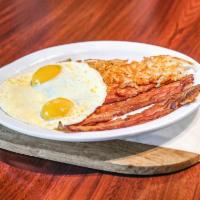 The Traditional Eggs · Choice of grilled ham, bacon, sausage patties, turkey bacon, or chicken apple sausage, and t...