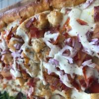 Chicken Ranchero Pizza · Chicken cutlet, bacon, tomato, onion, ricotta and ranch dressing.