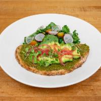 Green Brekky Toast · Super green pesto over sourdough topped with wilted spinach, avocado and kale salad. 