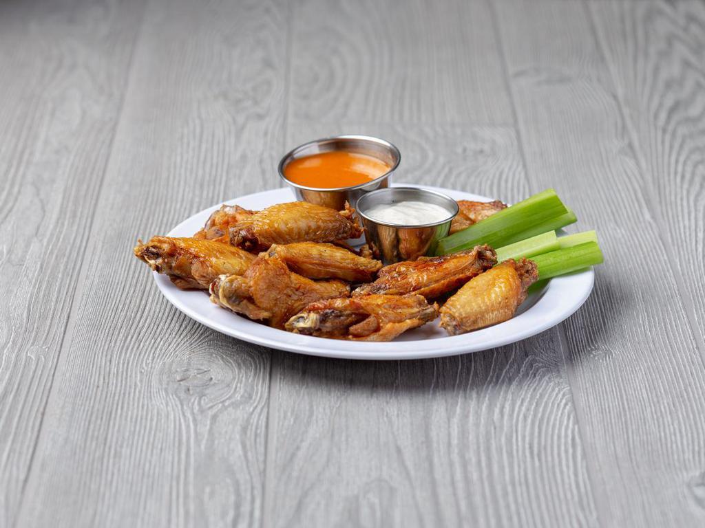 Chicken Wings · 10 tasty jumbo wings tossed in your choice of sauce. Served with celery and bleu cheese dressing.