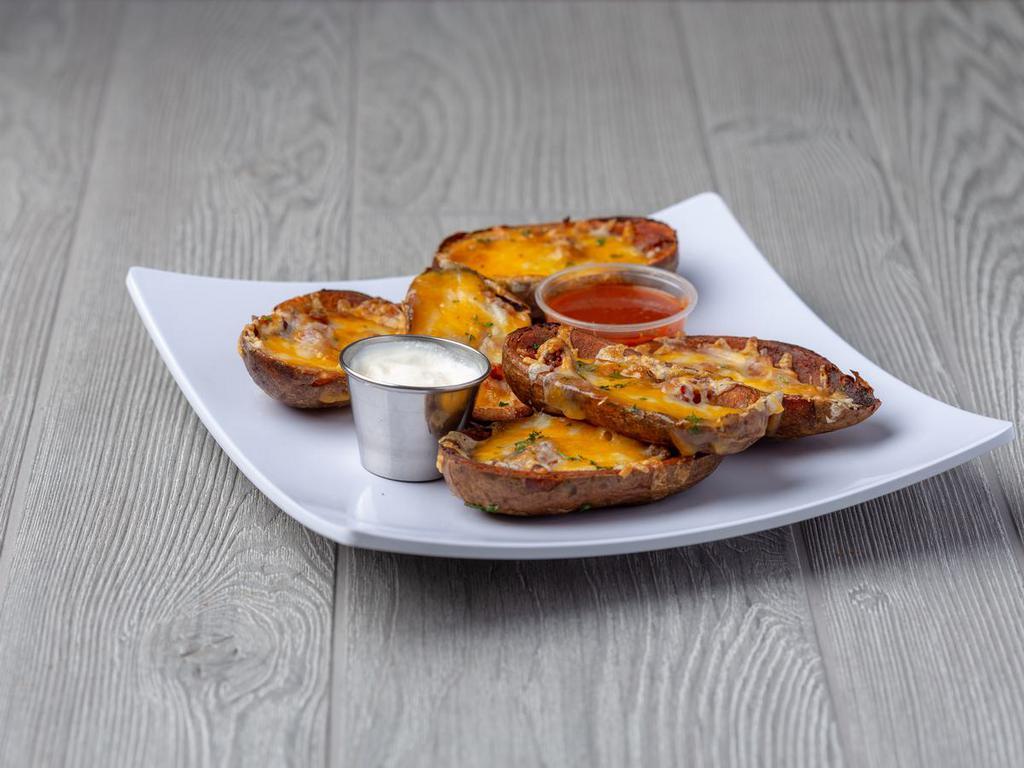 Potato Skins · Half skins loaded with mixed cheeses and bacon. Served with sour cream.