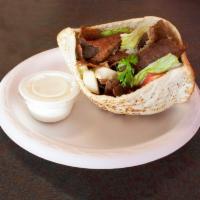 Gyro Sandwich · Specially seasoned beef or lamb charbroiled on a vertical rotisserie, sliced thin and served...