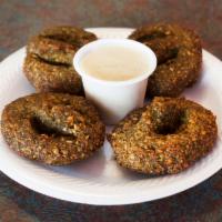 Falafel · A delightful mixture of ground chickpeas, parsley, onions, herbs and spices shaped into patt...