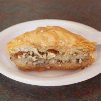 Baklava · A traditional Greek pastry made from flaky, crispy dough that is delightfully sweet, baked t...