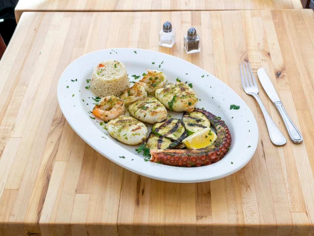 Grilled Seafood · Gluten-free. Shrimp, calamari, octopus served with grilled vegetables and rice in tomato sauce over orzo.
