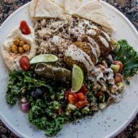Greek Platter · Falafel with lentil rice, hummus, tabbouleh, cucumber salad, Greek salad, dolma, and pita br...