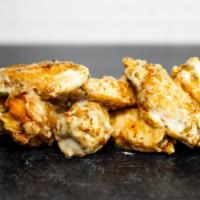 8 Classic Bone-In Wings · 8 classic bone-in chicken wings fried to perfection. Served with celery and carrots sticks w...