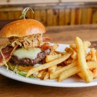 Smokehouse Burger · Topped with pepper jack cheese, bacon, BBQ sauce, and tobacco onions. Served with seasoned F...
