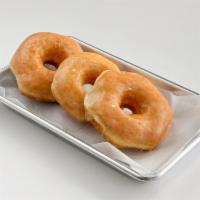 Dozen Glazed · A dozen of glazed donuts.