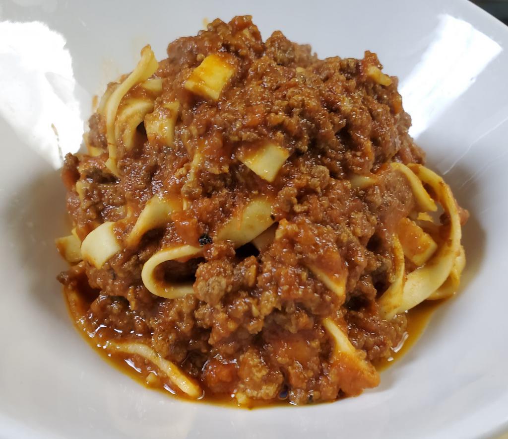 Tagliatelle Alla Bolognese · Fresh tagliatelle pasta in Angus beef bologonese sauce.