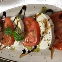 Caprese Insalate · Mozzarella and beefsteak tomatoes.