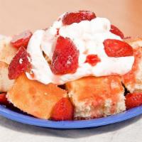 Strawberry Shortcake · Sponge cake served with whipped cream and strawberry topping
