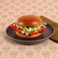 Buffalo Fried Chicken Sandwich · Fried Chicken breast, buffalo sauce, blue cheese, lettuce, tomato, brioche bun