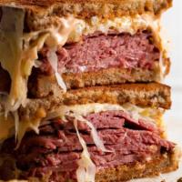 Reuben Sandwich · Pastrami or corn beef melted Swiss cheese, sauerkraut & Russian dressing served on a grilled...