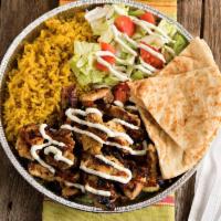 Grilled chicken over Rice Platter  · Grilled chicken over bed of yellow rice served with side of lettuce and tomatoes.