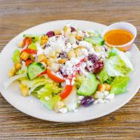 Greek Salad · Mixed lettuce, cucumbers, Kalamata olives, tomato, onions roasted peppers, feta cheese and c...