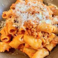 Rigatone · Rigatoni pasta, pomodoro sauce, sausage ragu, pecorino, garlic