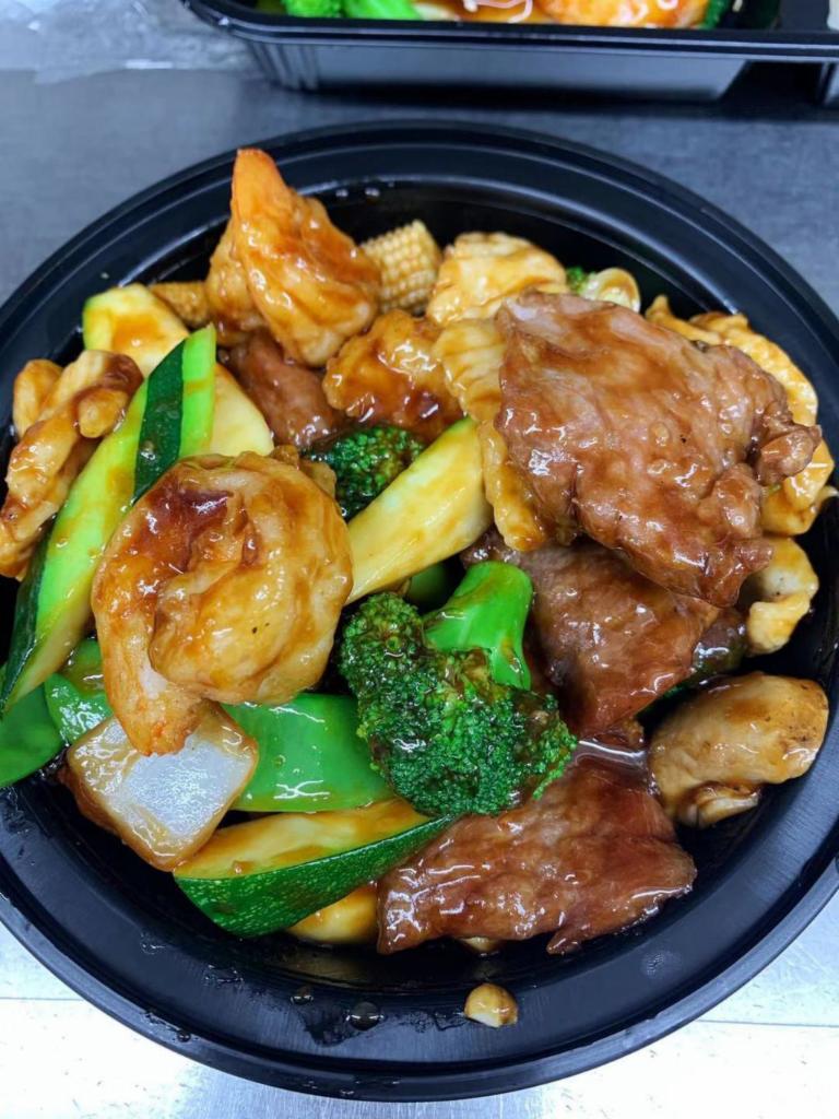 Triple Delights · Chicken, shrimp and beef with vegetable in savory sauce. Served w. Rice.