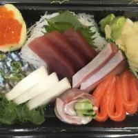 Sashimi Deluxe · 18 pieces of Assorted Sashimi. Served with soup or salad.