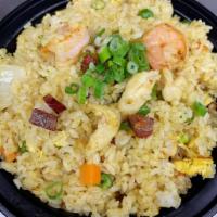 Singapore Curry Fried Rice · Curry Fried Rice w. Shrimp, Roast Pork and Chicken.