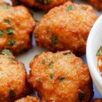 Fish Cakes · Tod mun. Comes with kaffir lime and cucumber relish.