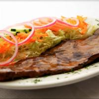 Carne Asada/Grilled Steak · Servido con frijoles, arroz, platano maduros, y ensalada. Served with beans, rice, sweet pla...