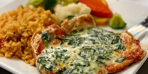 Chicken Popeye · Chicken breast with cheese and spinach. Served with rice and vegetables.