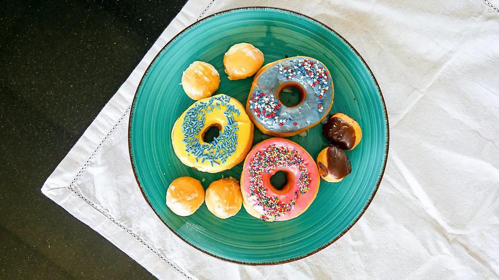 Dozen Assorted Donuts · Includes sprinkles, glaze, chocolate, strawberry iced, vanilla iced and cake.